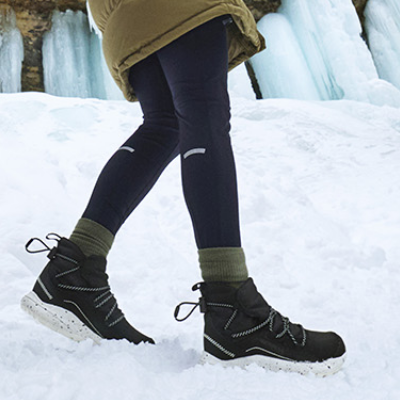 Woman walking on snow