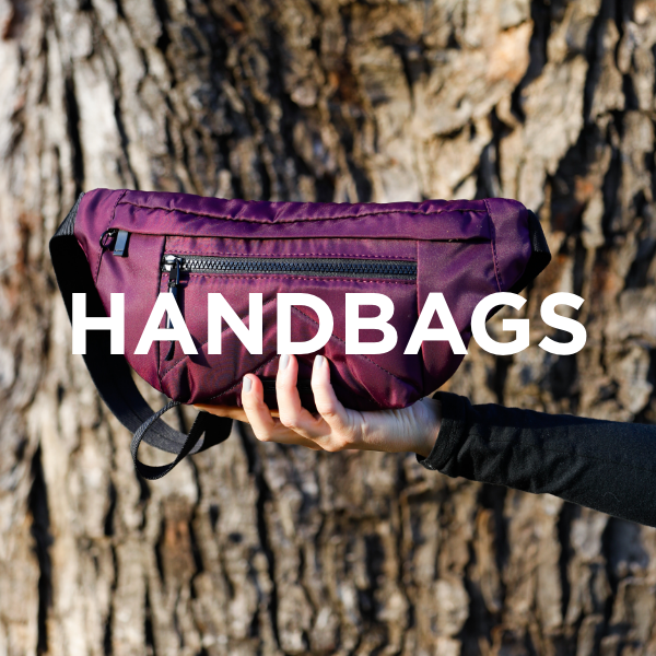 Woman holding handbag up