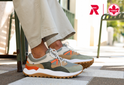 Man sitting in chair wearing Rieker sneakers