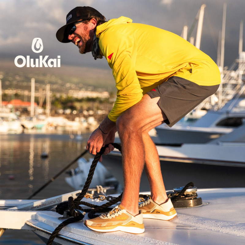 Man wearing Olukai shoes on boat