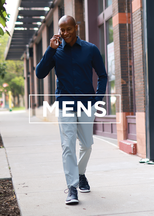 man walking down sidewalk