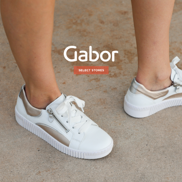 Woman standing on sidewalk in Gabor sneakers