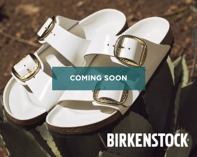 Birkenstock sandals sitting on ground 