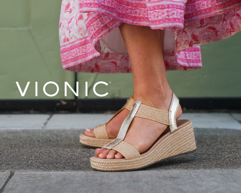 Woman wearing Vionic sandals on sidewalk