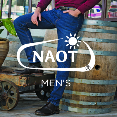 Man standing in front of wine barrel 