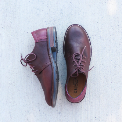 Men's Naot shoe on sidewalk