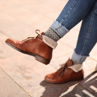 Woman crossing legs sitting down