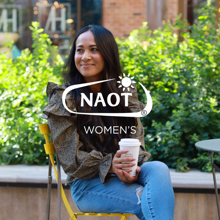Woman sitting in chair holding coffee