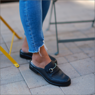 Woman sitting in Naot shoes 