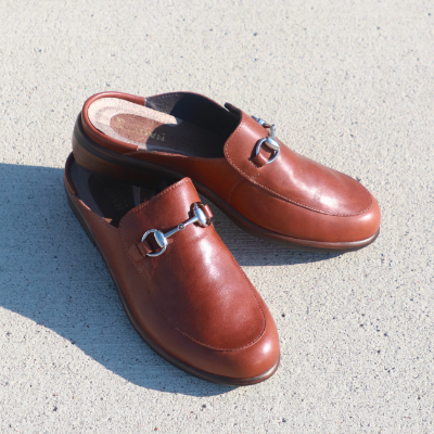 Naot shoes sitting on sidewalk