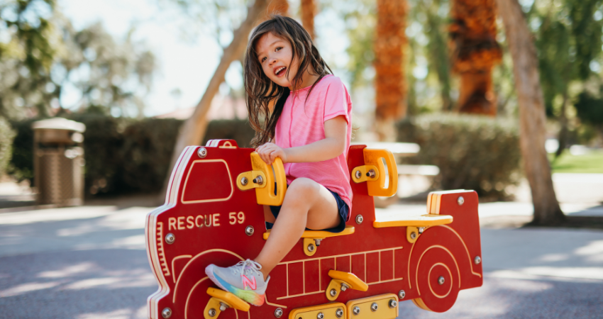 Little girl playing on playground