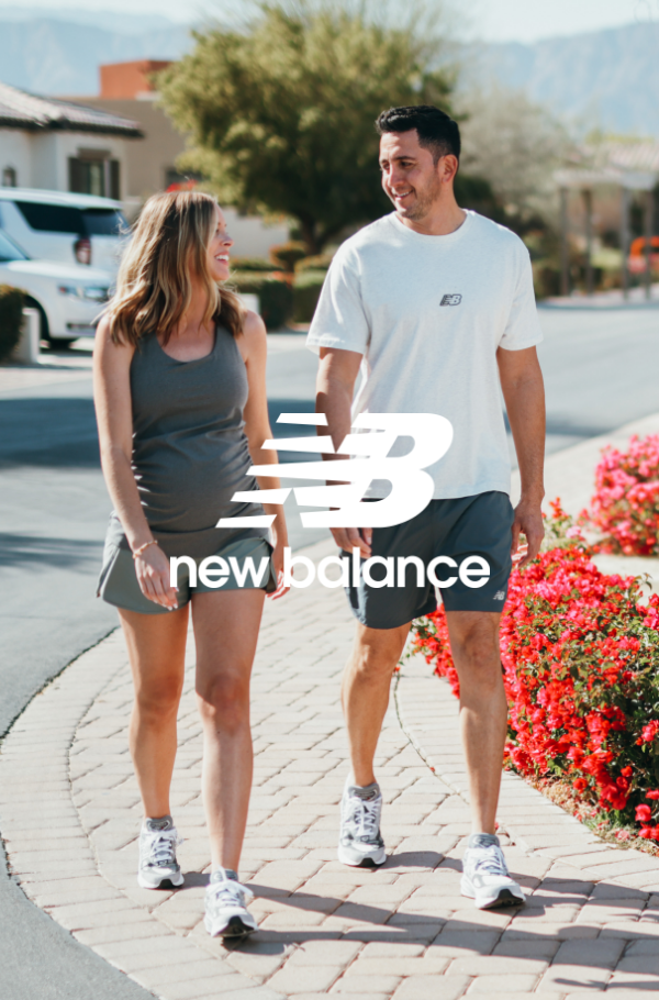Man and woman walking on sidewalk