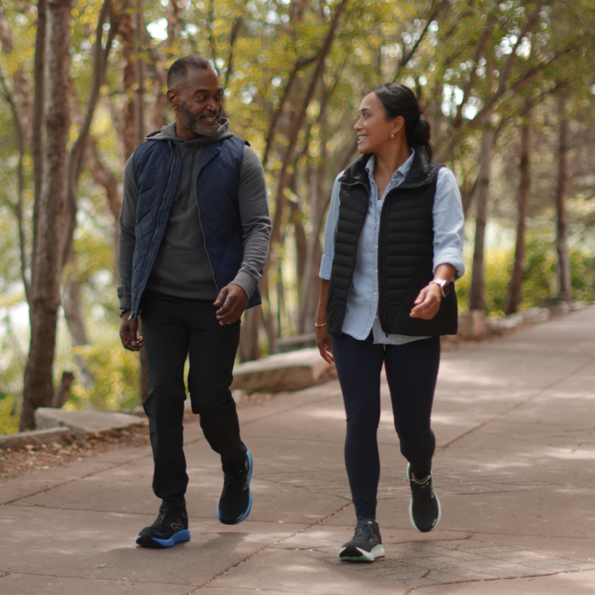 Man and woman walking in park