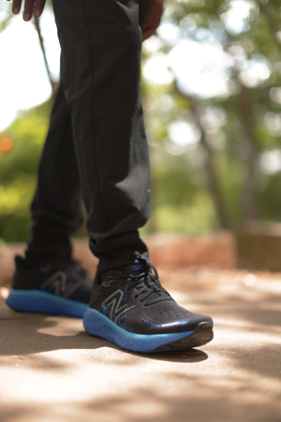Man posing feet towards camera
