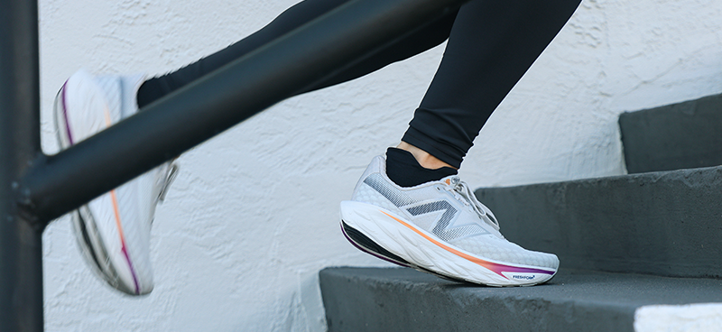 Woman wearing New Balance 1080 v14 running shoes