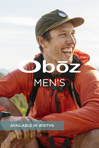 Man smiling with hiking gear on