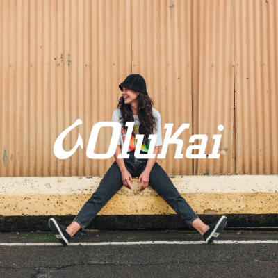 Woman sitting on curb posing 