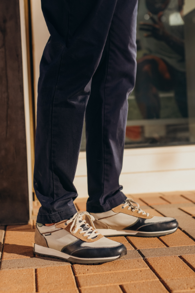 Man standing on sidewalk