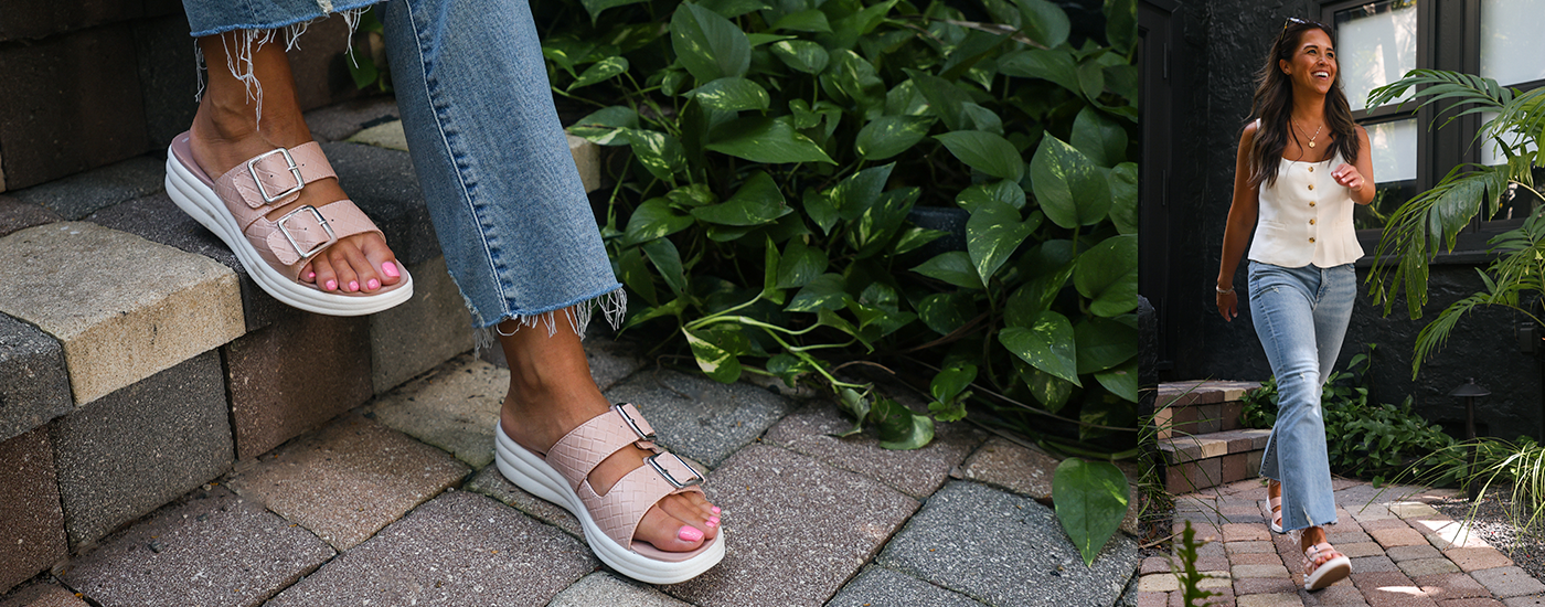 Clarks Drift Buckle Woman wearing frayed jeans and pink Clarks Drift Buckle slip on sandals
