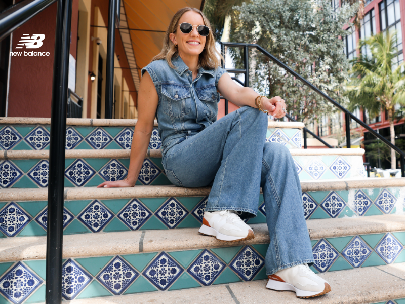 Woman sitting on steps wearing New Balance 327 Lifestyle sneakers