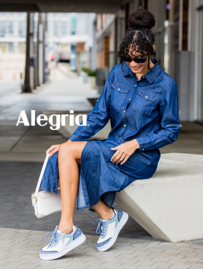 Woman sitting on bench wearing Alegria sneakers