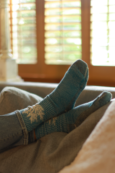 Woman crossing feet on couch