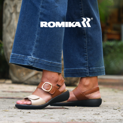 Woman standing on sidewalk wearing Romika Ibiza 12