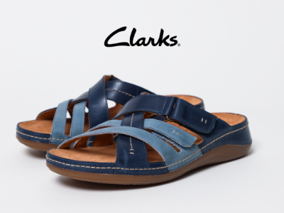 Clarks sandals sitting on white background