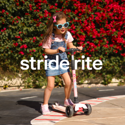 Little girl riding scooter