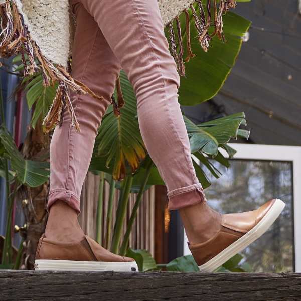 Woman walking on ledge 