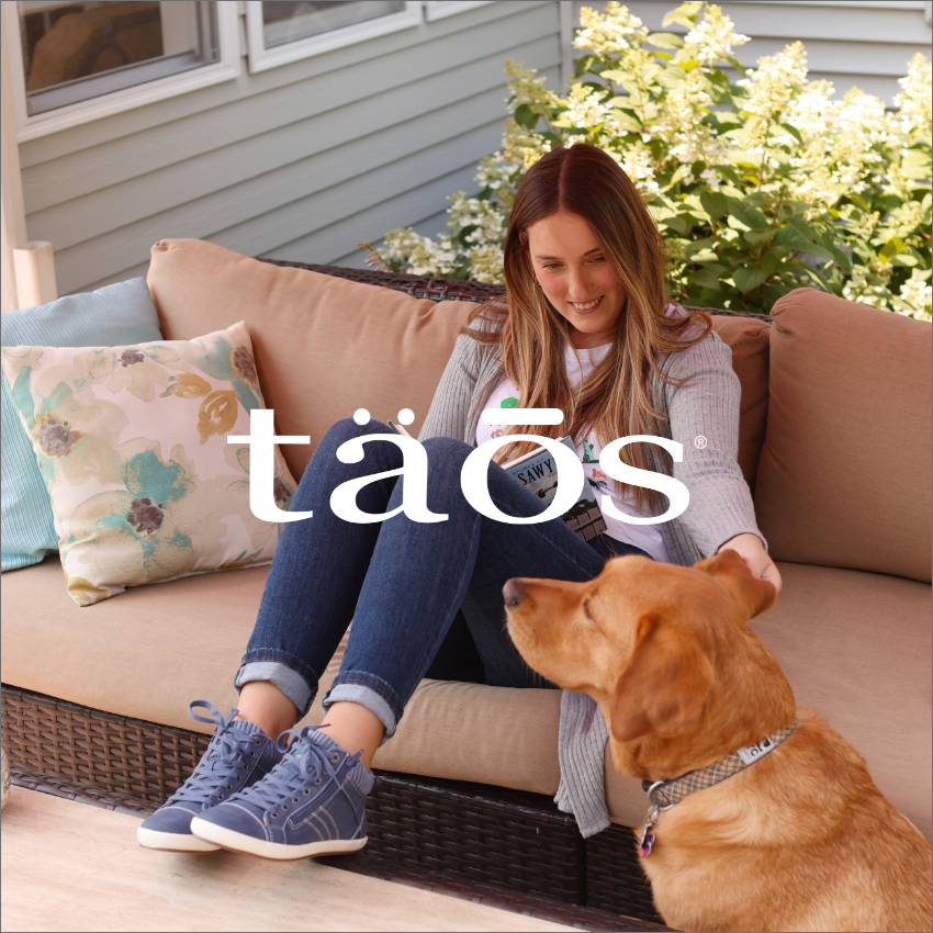 Woman petting dog in Taos shoes