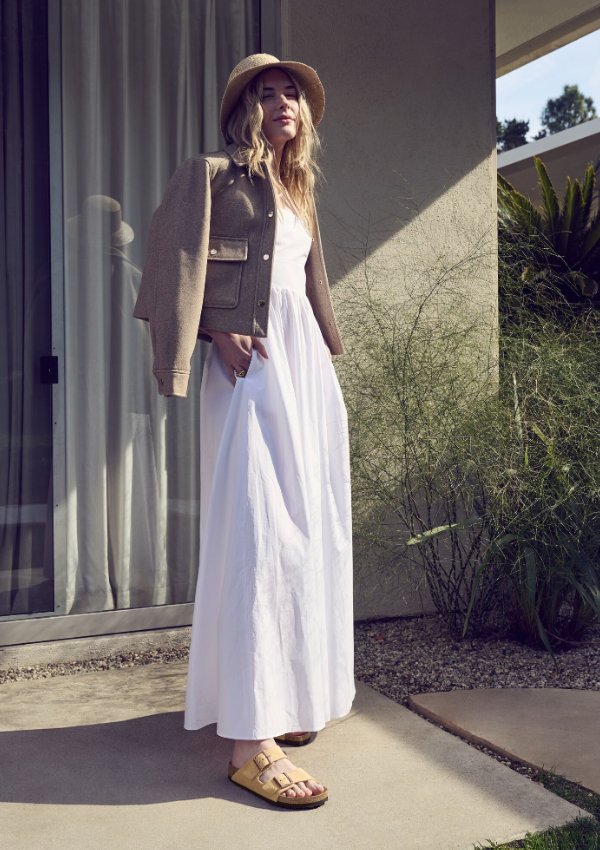 Woman in dress wearing Birkenstock sandals on vacation