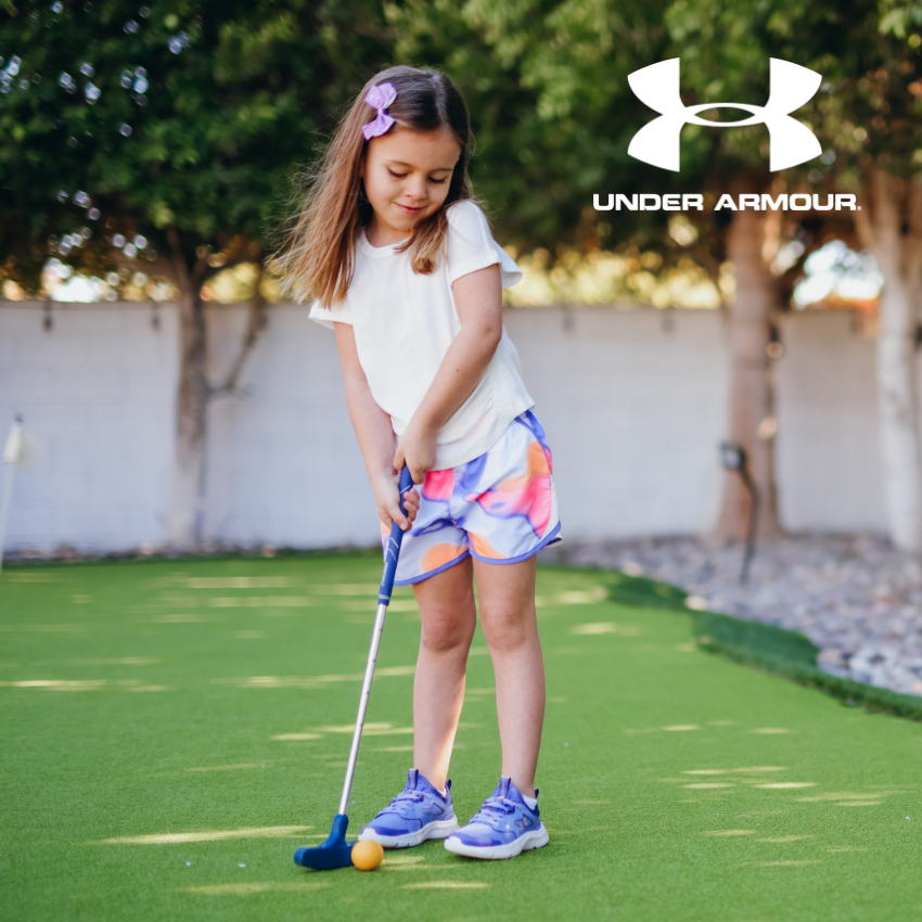 Girl playing mini golf