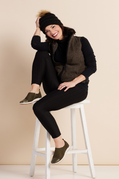 Woman posing in high top chair