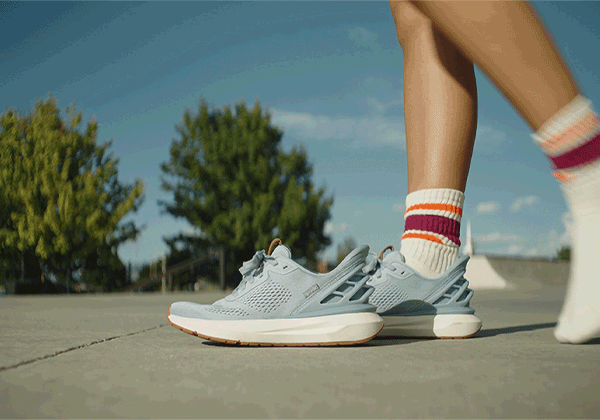 Foot stepping into Kizik shoe