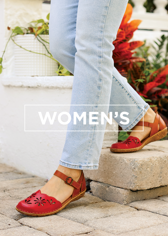 Woman stepping down onto the sidewalk wearing closed toe shoes