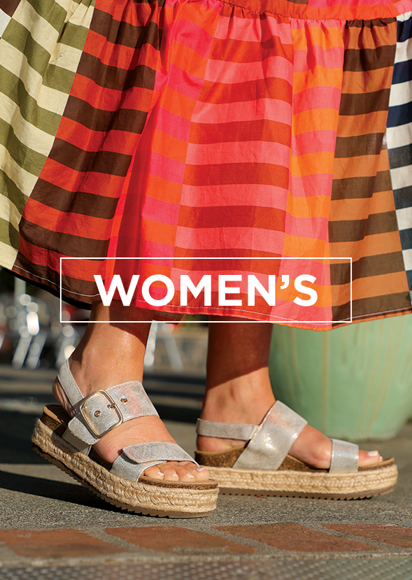Close up of woman wearing sandals and a long dress with overlay text "WOMENS"